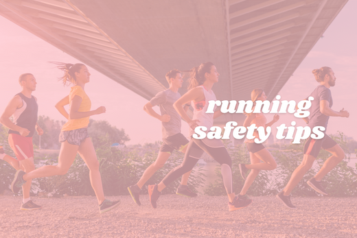 A group of runners, both men and women, are jogging together under a bridge. The sky is clear, and they are running on a gravel path surrounded by greenery. The text "running safety tips" is overlaid on the image in white font.