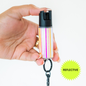 A reflective pepper spray in color opal blush, attached to a keychain.